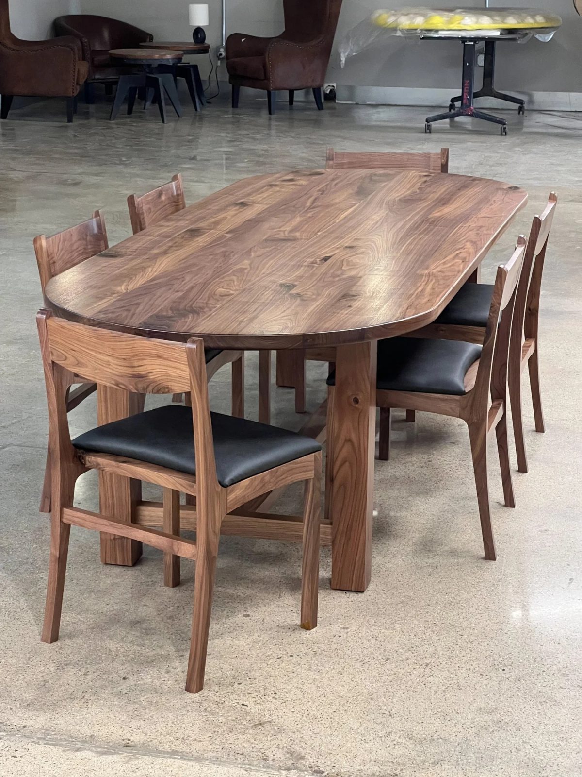 black walnut wooden dining table and chairs with black upholstery seat covering