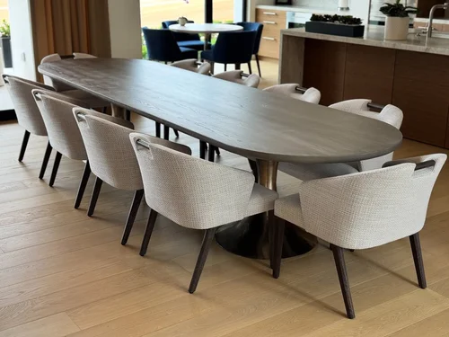 large oval dining table with chairs